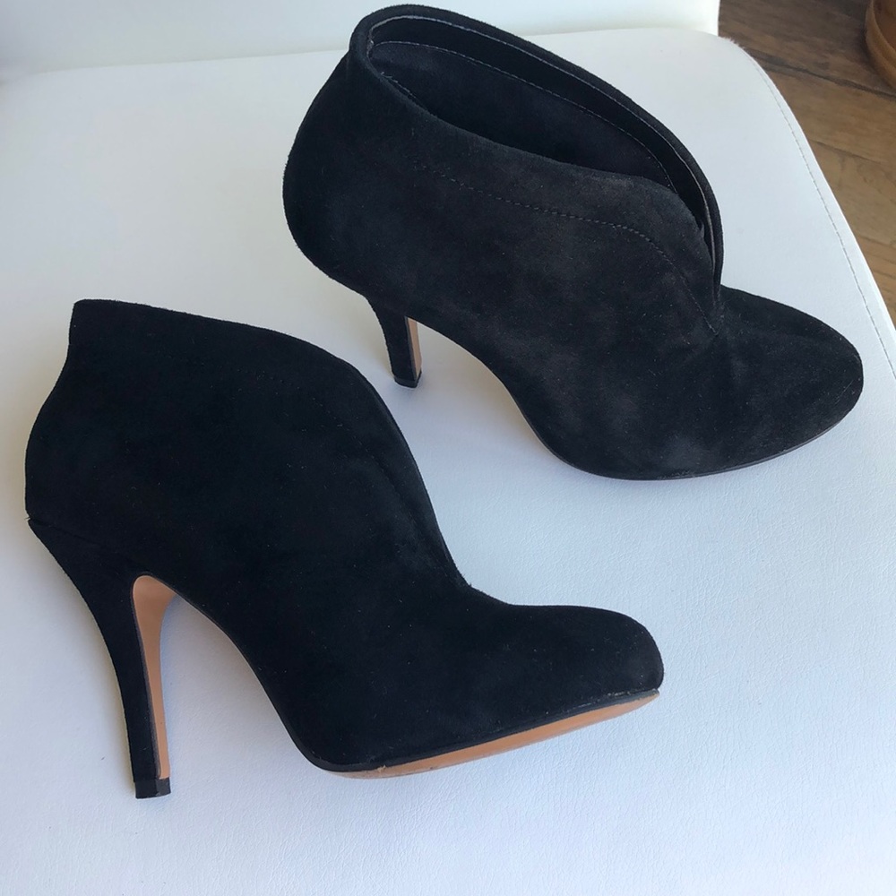 Black suede slip on ankle boots.